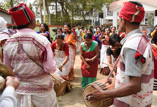 Guwahati, India. 17 February 2021. Mising tribal people dancing during Ali-Aye-Ligang festival in Guwahati, India on 17 February 2021. Ali-Aye-Ligang, the main harvest festival of the ethnic Mising community people, this spring festival associated with agriculture, especially with the beginning of the Ahu paddy cultivation.