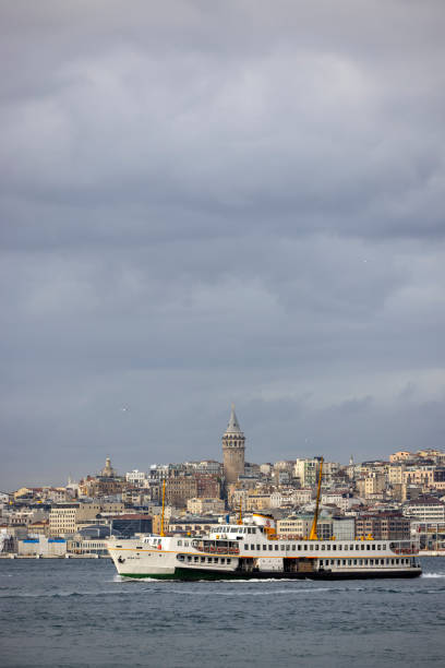 Galata Tower and Ferry in Istanbul stock photo