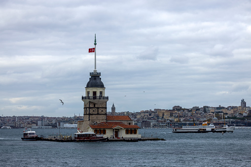 Istanbul-Turkey - November, 19, 2020:Passenger ferries and Maiden's Tower in Istanbul