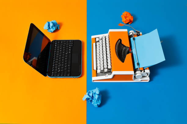 istock Digital and analog – Laptop and 70s Typewriter 1306523659