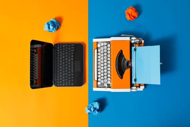 istock Digital and analog – Laptop and 70s Typewriter 1306523918