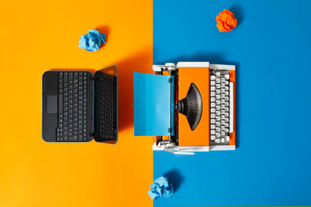 istock Digital and analog – Laptop and 70s Typewriter 1306523984