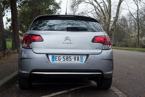 Mulhouse - France - 7 March 2021 - Rear view of grey Citroen C4 parked in the street