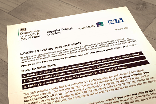 Canterbury, Kent, England - Nov 20 2020: Coronavirus home test kit letter on counter top at home in Canterbury on 20th November in Kent, England, UK.