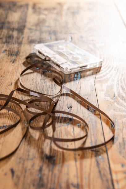 istock Cassette tape on a wooden table with a cassette in the background 1306525689