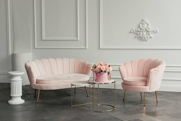 istock Pink minimalistic furniture on white wall background 1306526637