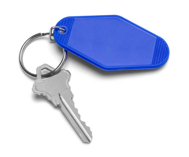 Motel Key Motel Key With Blue Palstic Tag Cut Out. key ring stock pictures, royalty-free photos & images