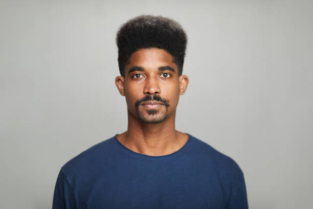 istock Hispanic man headshot looking at the camera. 1306528463