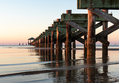 Past hurricane damaged this pier leaving just the foundations and the covered end structure  without a walking deck, Biloxi, Mississippi