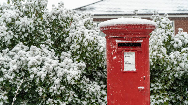 istock Red post box in the snow at Christmas 1306529716