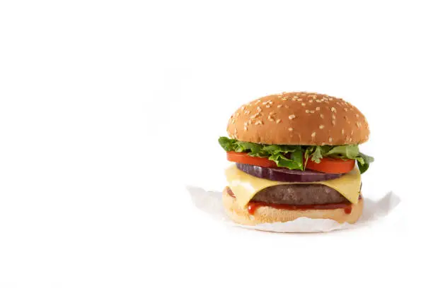 Cheeseburger with beef,tomato, lettuce and onion isolated on white background