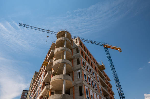 istock Construction tower cranes on a building site against the sky stock photo 1306532361