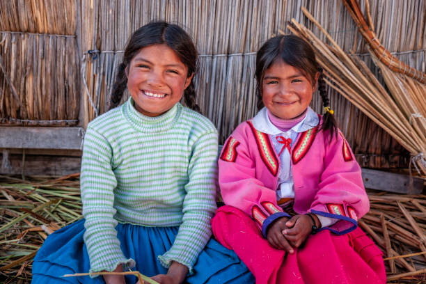 istock Happy children on Uros floating island, Lake Tititcaca, Peru 1306532403