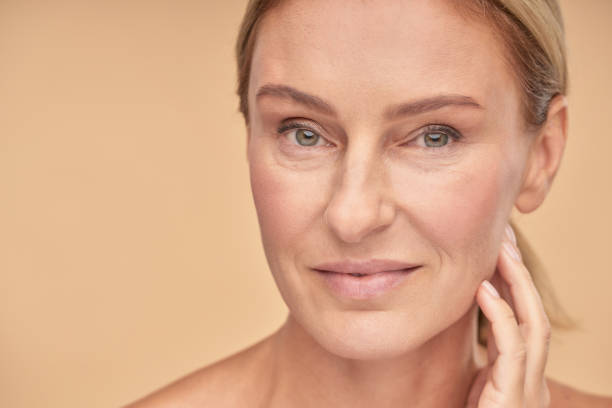 istock Close up of pretty mature lady posing in studio 1306532467