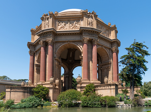 San Francisco, California, USA - August 2019: People visiting the Palace of Fine Arts, a monumental structure constructed for the 1915 Expo