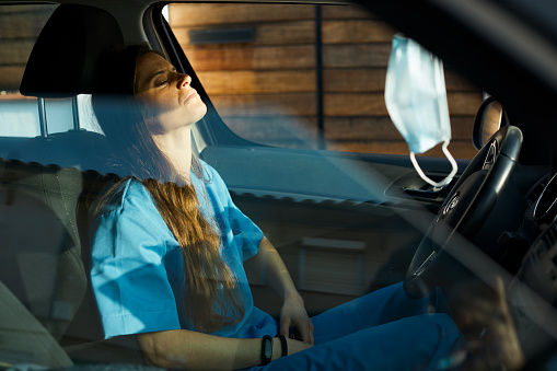 Day in the life of an essential worker.
Made in Barcelona.
Nurse and healthcare workers.
A female nurse is resting inside her car.