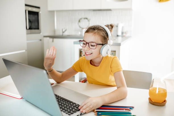 istock A little girl attending online classes at home 1306534129