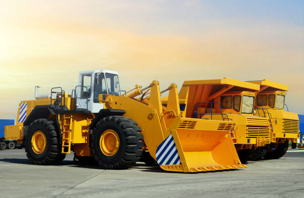 istock Wheel loader and mining truck. Heavy construction machinery and mining equipment 1306536192
