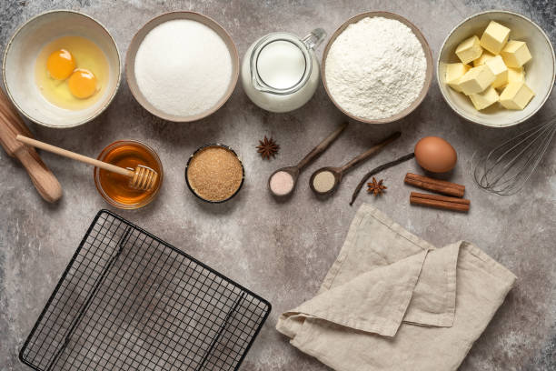 istock Baking background. Baking ingredients: flour, eggs, sugar, honey, butter, milk and spices on grunge background. Top view. 1306536737