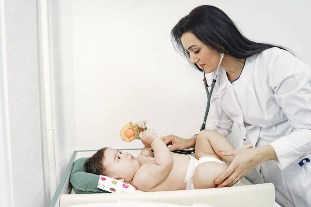 istock Pediatrician in a white coat examines baby with a stethoscope 1306538347