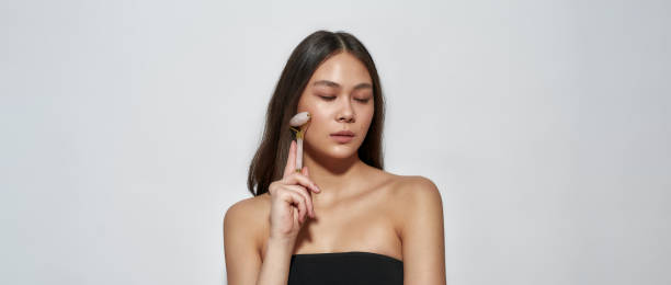 istock Girl standing in the studio and cleans skin 1306538363
