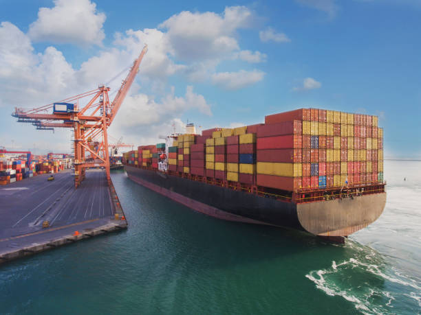 istock Aerial view of container freight ship carrying container box for import and export business logistic. 1306541503