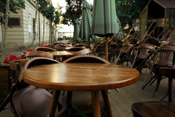 istock Empty chairs and tables near the summer cafe 1306542969
