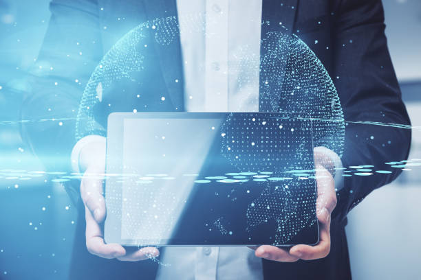 istock World network and telecommunication concept with digital earth planet on businessman with digital tablet background 1306543809