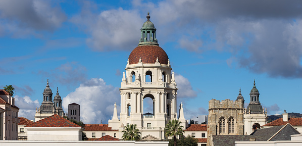 Vibrant image of the Pasadena City Hall towers against a blue sky with rain clouds. This historic government building was inaugurated in 1927.