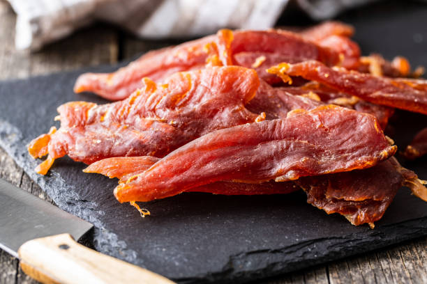 istock Dried chicken meat. Tasty jerky meat. 1306546651