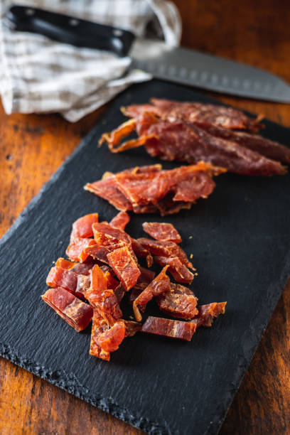 istock Dried chicken meat. Tasty jerky meat. 1306546745