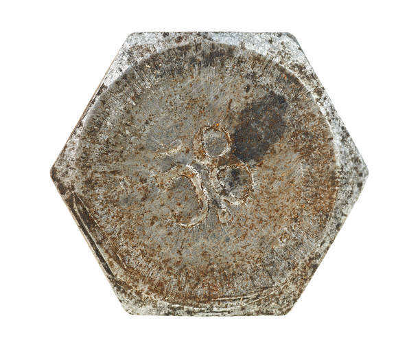 Rusty metal bolt head isolated on a white background. Old rusty screw head.