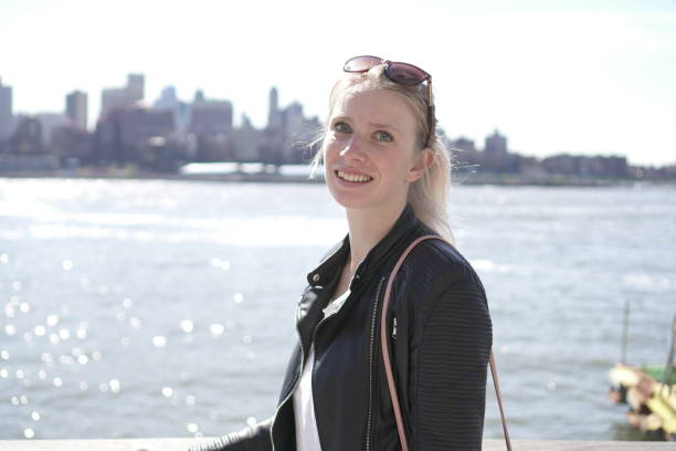 istock Girl posing infront of brooklyn 1306547926