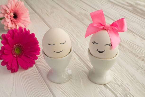 istock Easter composition with white eggs in white coasters on white wooden backgrounda 1306548061