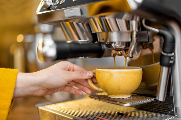 istock Making espresso drink on a professional coffee machine at home. 1306549089