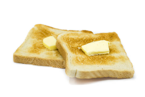 istock Toast bread with butter isolated on white background 1306550432