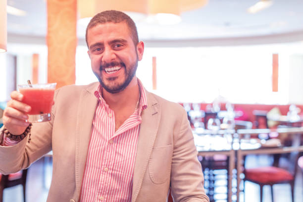 istock Portrait of a cheerful man toasting a drink 1306553713