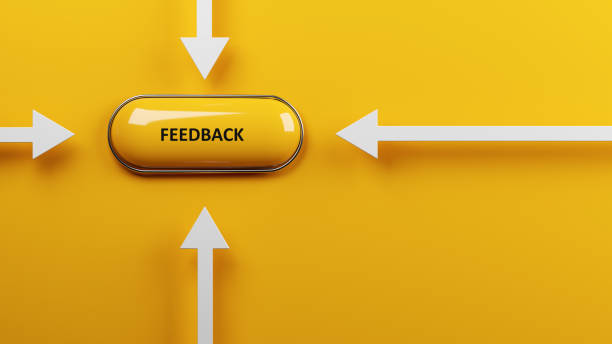 Feedback concept Feedback text and yellow-colored push button on yellow-colored background stock photo