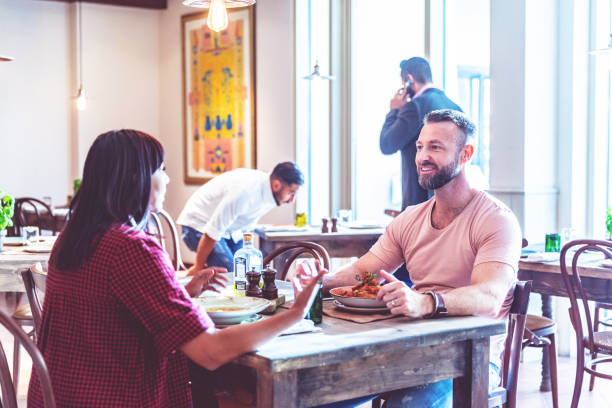 istock Young couple visiting a local restaurant for weekend lunch 1306557394