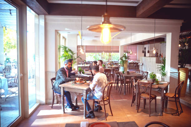 istock Friends meeting for weekend brunch at a restaurant 1306557496