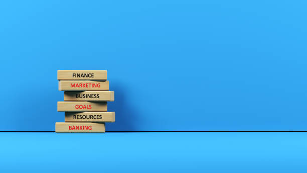 istock Finances concept Wooden cube blocks under finance text header on blue background 1306558356