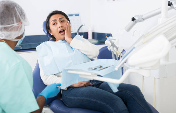 istock Professional doctor man talking with patient in chair 1306558872