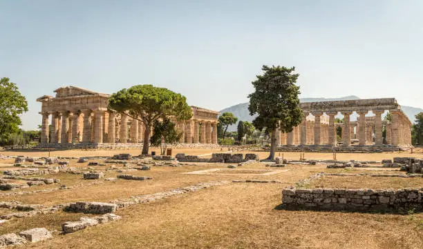 Archaeological site of Paestum , Archaic Temple and Temple of Hera II (also erroneously called the Temple of Neptune or of Poseidon), Campania, Italy