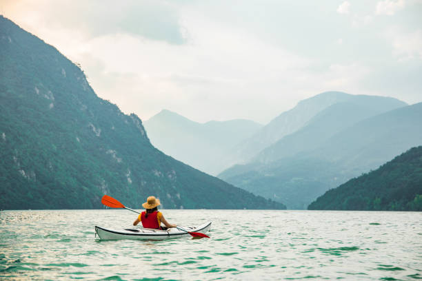 istock Relaxing kayak ride on a calm lake 1306564386