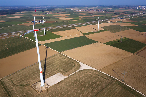 Photovoltaic solar panels and wind turbines under the blue sky