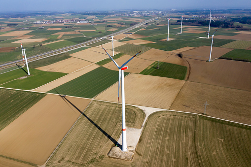 Aerial view of wind power plant in spring landscape.