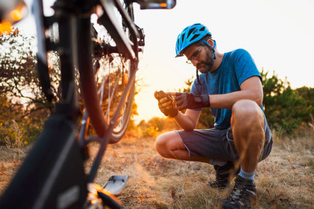 Male biker searching tips on the internet for bicycle repair