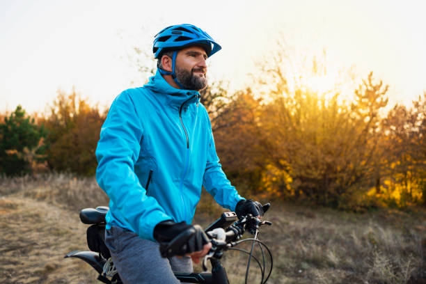 istock Male biker on his bike, looking 1306566755