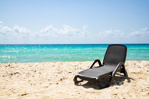 Single Chair at Cancun Beach during the covid 19 - coronarvirus pandemic.