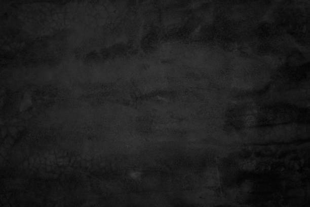 istock Close up retro plain dark black cement & concrete wall background texture for show or advertise or promote product and content on display and web design element concept decor. 1306569082